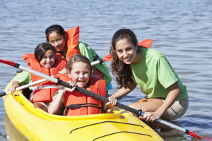 summer camp girls in kayak